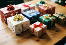 Assorted Christmas Gifts Wrapped with Colorful Ribbons