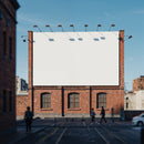 Empty billboard on brick building in urban street