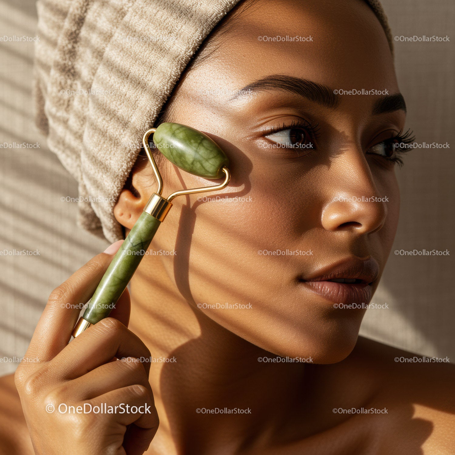 Woman Using Jade Roller for Facial Skin Care and Rejuvenation