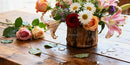 Rustic Wooden Vase with Diverse Fresh Flowers on Table