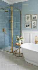 Elegant bathroom with gold accents and blue tile shower