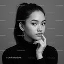 Elegant Black and White Portrait of a Woman with Stylish Hoop Earrings