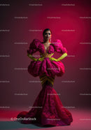 Fashion Model in Vibrant Pink and Yellow Flowing Gown