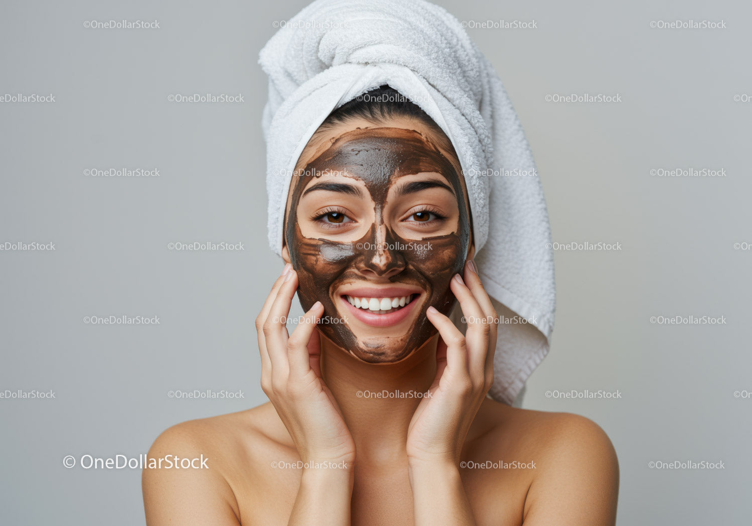 Smiling Woman with Brown Facial Mask and Towel Wrap