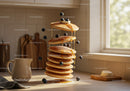 Stack of fluffy pancakes with blueberries and syrup