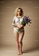 Portrait of a Woman with Tattoos Holding Lavender and Flowers