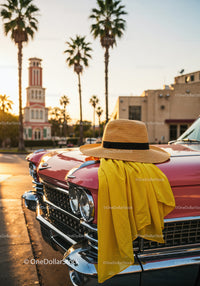 Stylish Red Convertible Car with Straw Hat and Yellow Scarf in Sunset