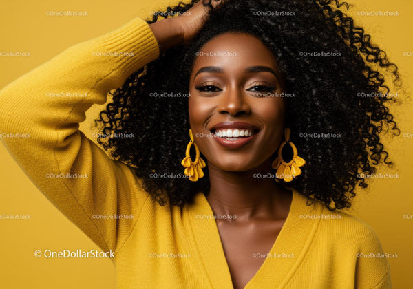 Portrait of a Smiling Woman with Curly Hair Wearing Yellow Fashion