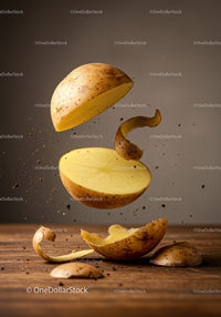 Sliced potato floating with peeling and dirt particles
