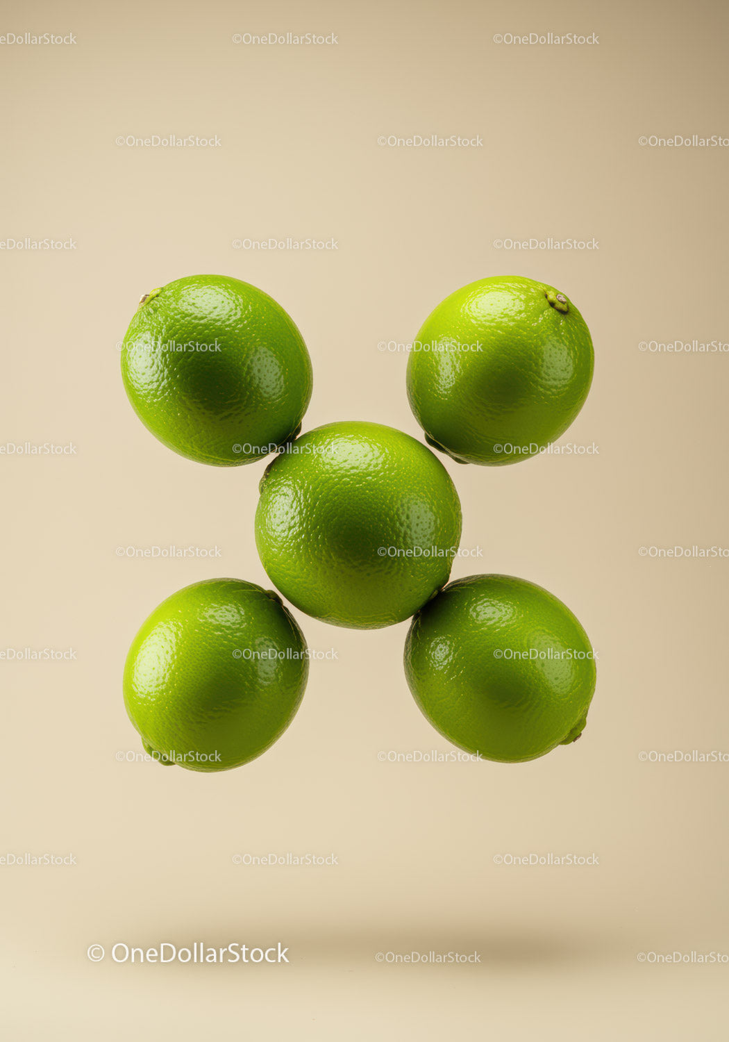 Fresh green limes arranged on beige background