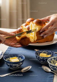 Fresh Baked Loaf of Bread with Butter and Blue Bowls in Cozy Kitchen
