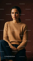 Elegant young woman in cozy sweater against dark background