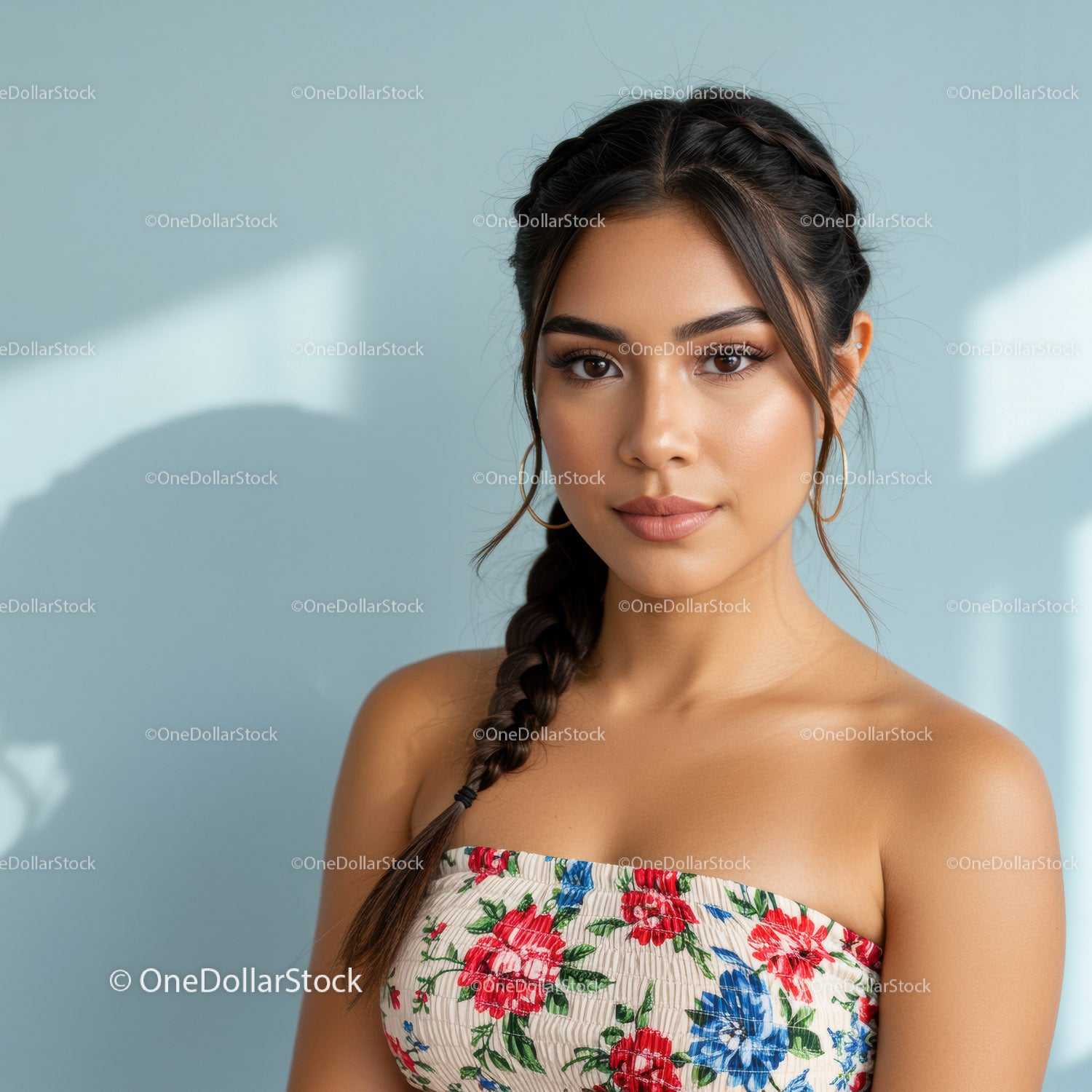 Portrait of a Young Woman with Braided Hair and Floral Top