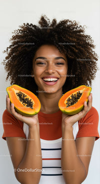 Vibrant Portrait of Woman Holding Fresh Papaya Slices with Bright Smile