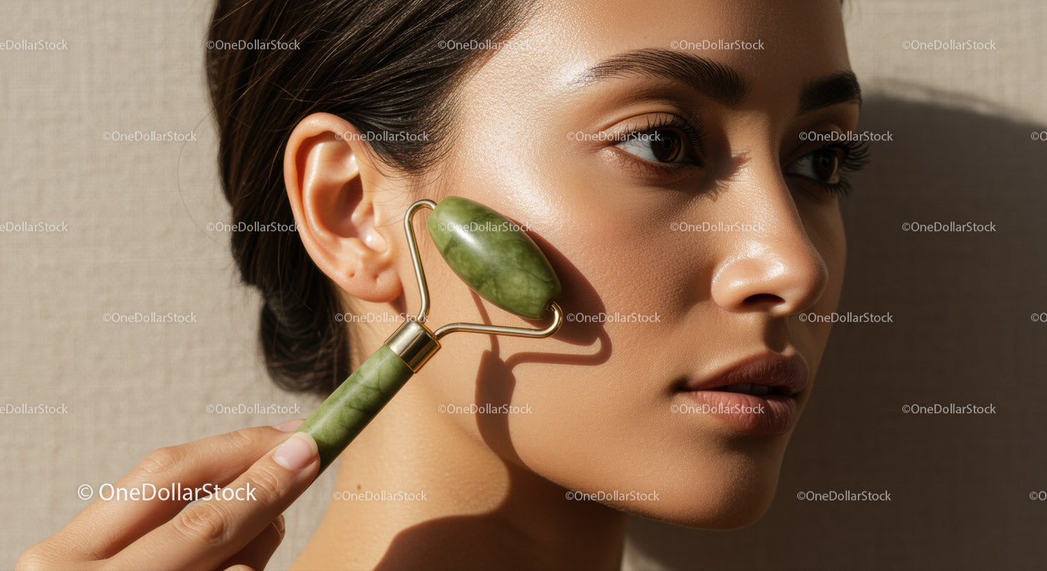 Close-up of Woman Using Jade Roller for Facial Skin Care