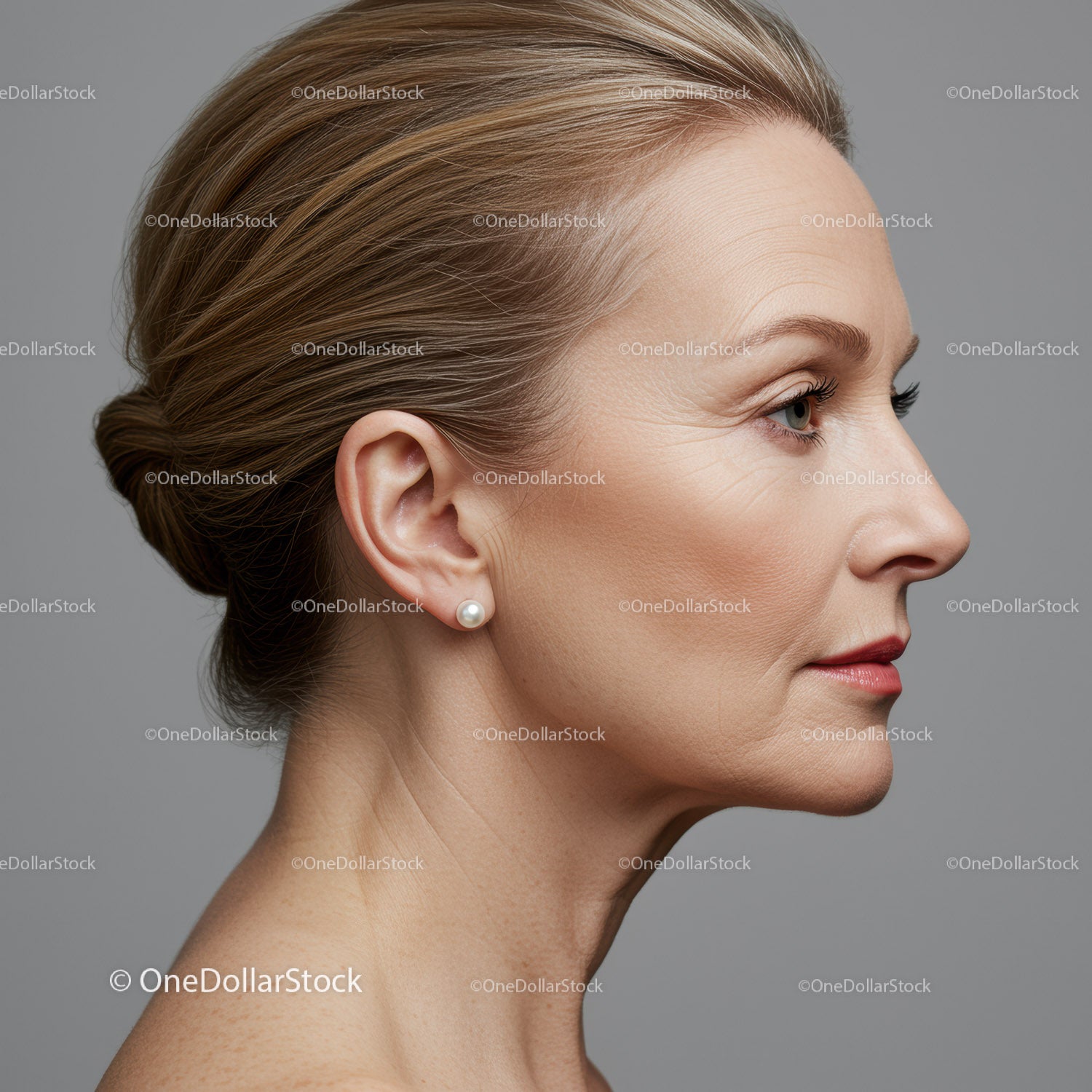 Elegant Mature Woman Side Profile with Stylish Hair and Pearl Earring