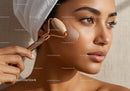 Woman Using Jade Facial Roller for Skin Rejuvenation
