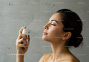 Woman Using Facial Mist for Hydration and Skin Refreshment