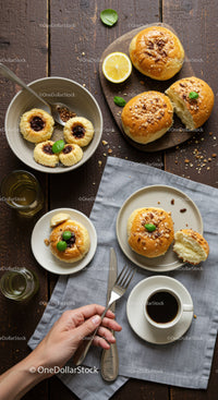 Freshly baked buns and jam cookies with coffee break