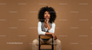 Stylish Confident Woman Sitting on Chair in Modern Studio