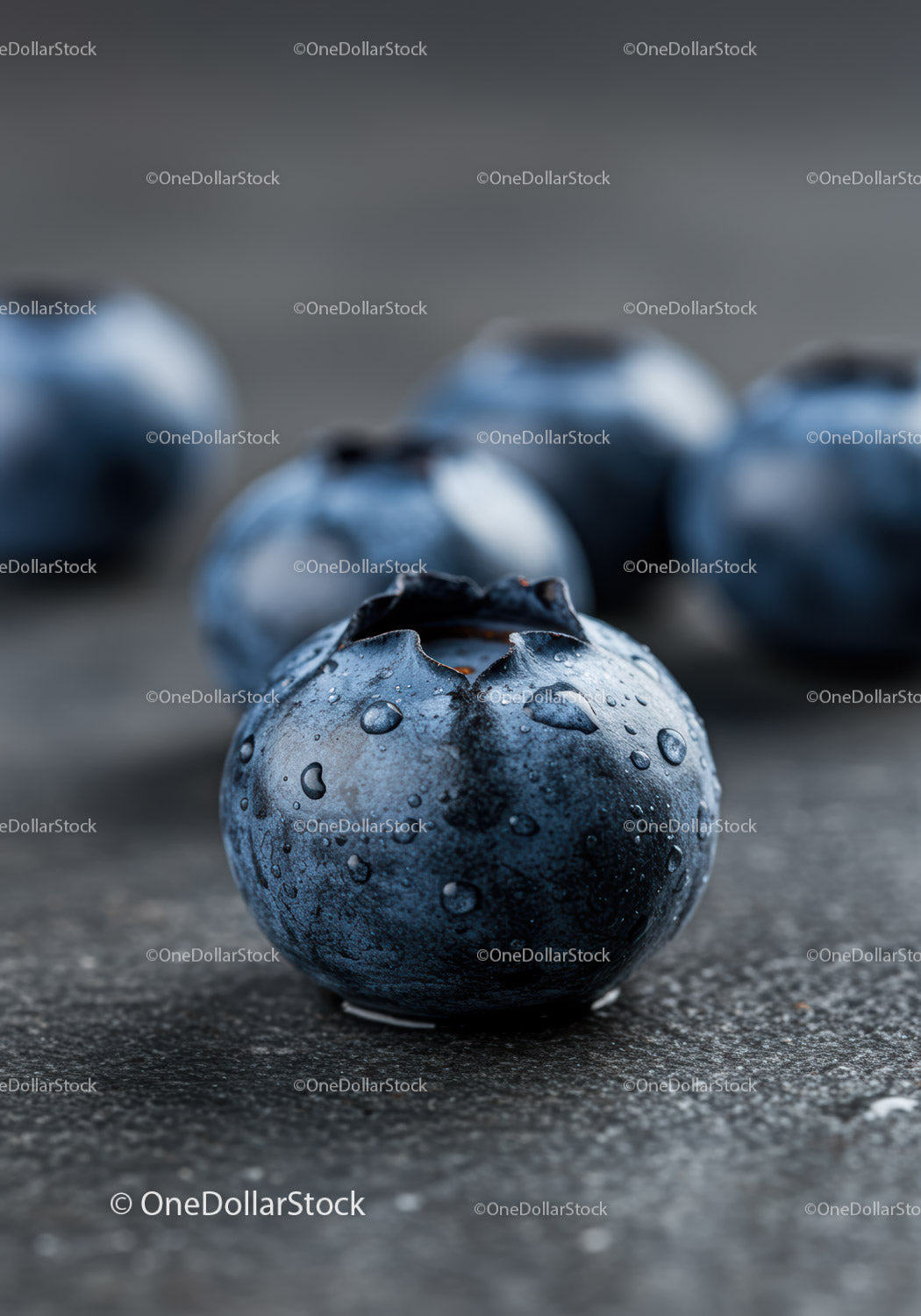 Fresh Dewy Blueberries on Dark Textured Surface