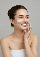 Young Woman Applying Face Cream for Skincare Routine