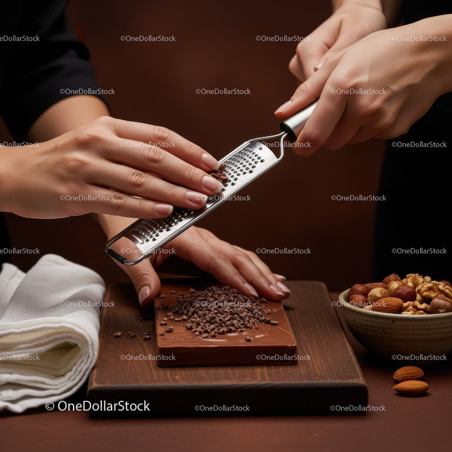 Hands Grating Chocolate on a Steel Grater for Gourmet Dessert