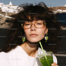 Stylish Woman with Green Smoothie and Sunglasses Outdoors
