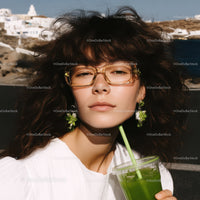 Stylish Woman with Green Smoothie and Sunglasses Outdoors