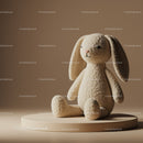 Soft Plush Bunny Toy Sitting on Round Pedestal