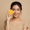Smiling Asian Woman Holding Fresh Orange Citrus Fruit