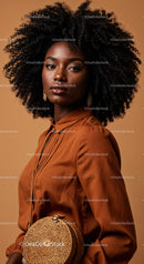 Elegant Portrait of an African Woman with Natural Curly Hair in Brown Blouse