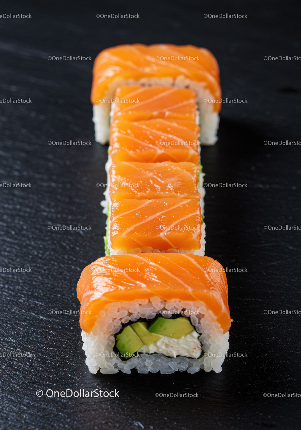 Fresh salmon sushi roll with avocado and cream cheese