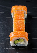 Fresh salmon sushi roll with avocado and cream cheese