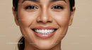 Close-up of smiling woman with radiant healthy skin