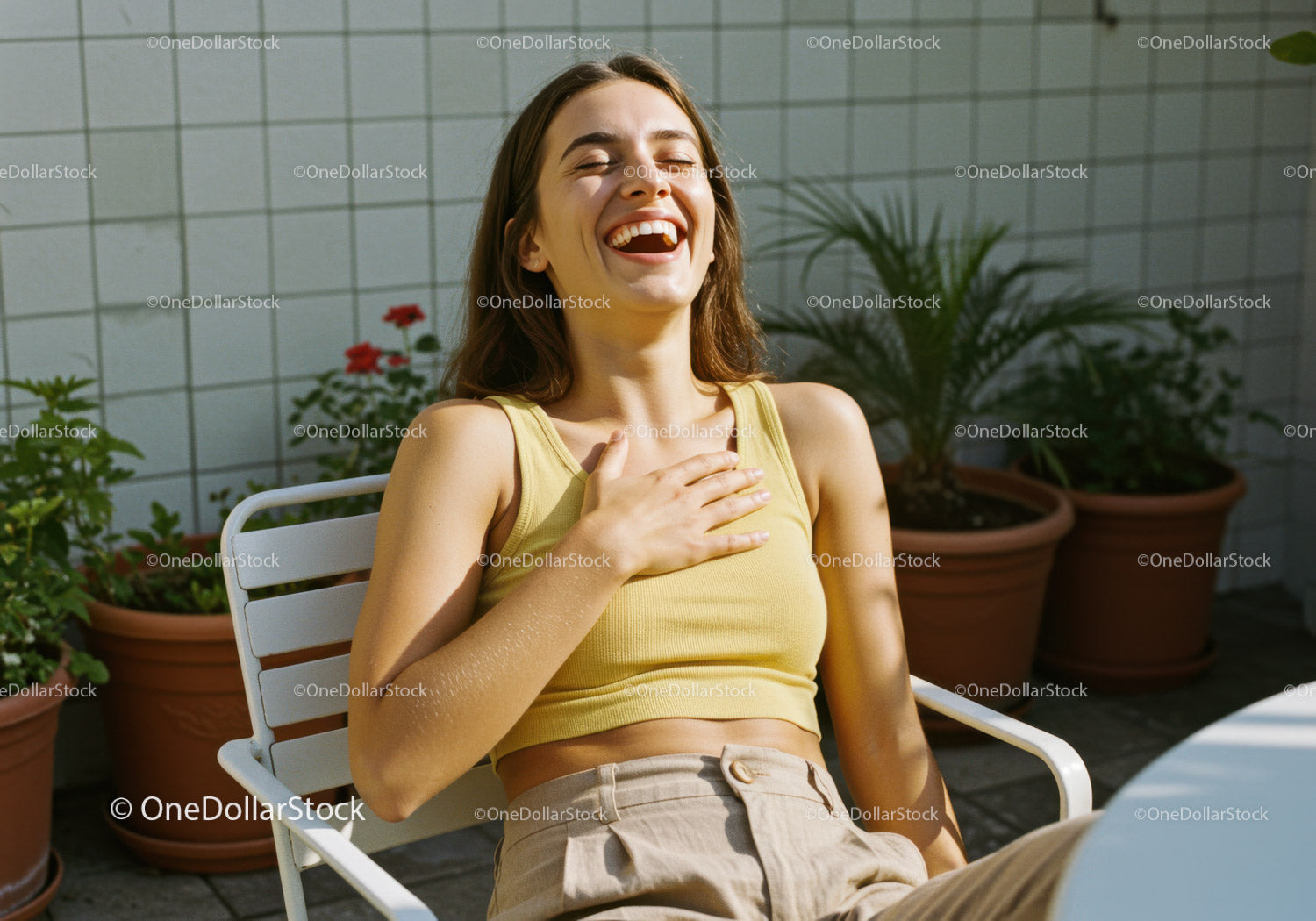 Young Woman Laughing and Relaxing Outdoors in Sunny Garden