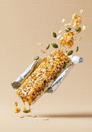 Granola bar with seeds and honey dripping