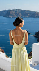 Woman in Yellow Dress Enjoying Scenic Ocean View