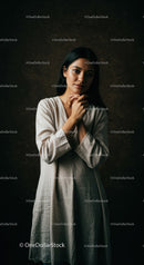 Thoughtful young woman in natural linen dress