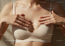 Close-Up of Woman Applying Body Oil to Youthful Skin in Sunshine