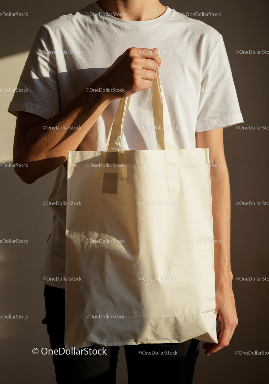 Person Holding Plain Canvas Tote Bag in Natural Light