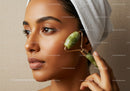 Asian Woman Using Jade Roller for Facial Massage Skincare Routine