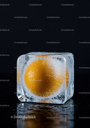 Orange Fruit Frozen Inside a Clear Ice Cube