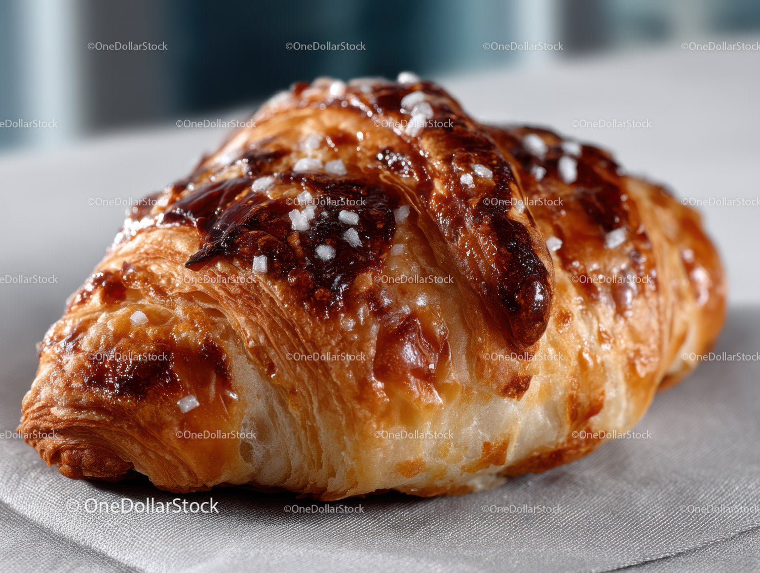 Freshly Baked Croissant with Glaze and Sugar Dusting