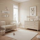 Bright and Cozy Baby Nursery with Beige Walls and Wooden Furniture
