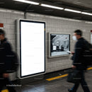 Commuters walking past empty digital billboard in subway