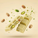 Broken white chocolate bar with pistachios flying