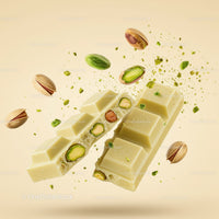 Broken white chocolate bar with pistachios flying