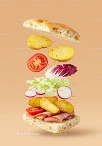 Fresh sandwich ingredients flying in midair on beige background