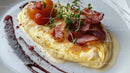 Gourmet Breakfast Plate with Bacon Cherry Tomatoes and Microgreens
